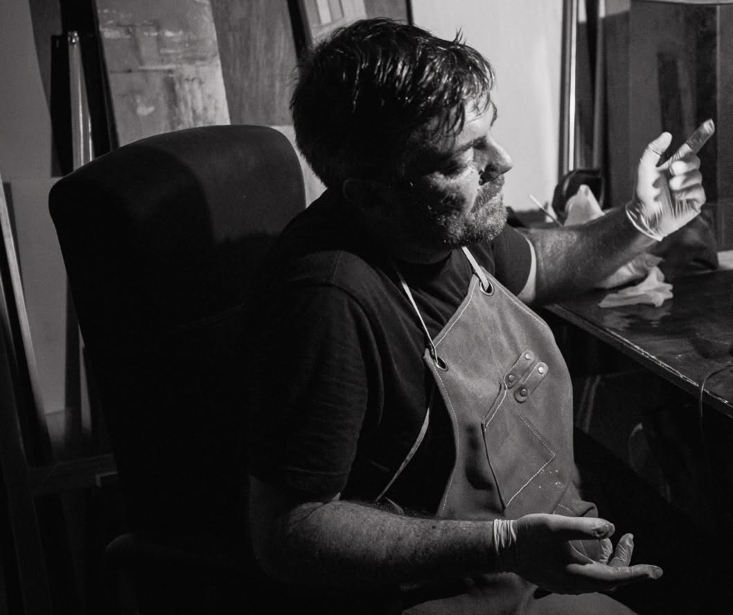 Documentary portrait of artist Clint Calleja in his studio with conservation pigment studies